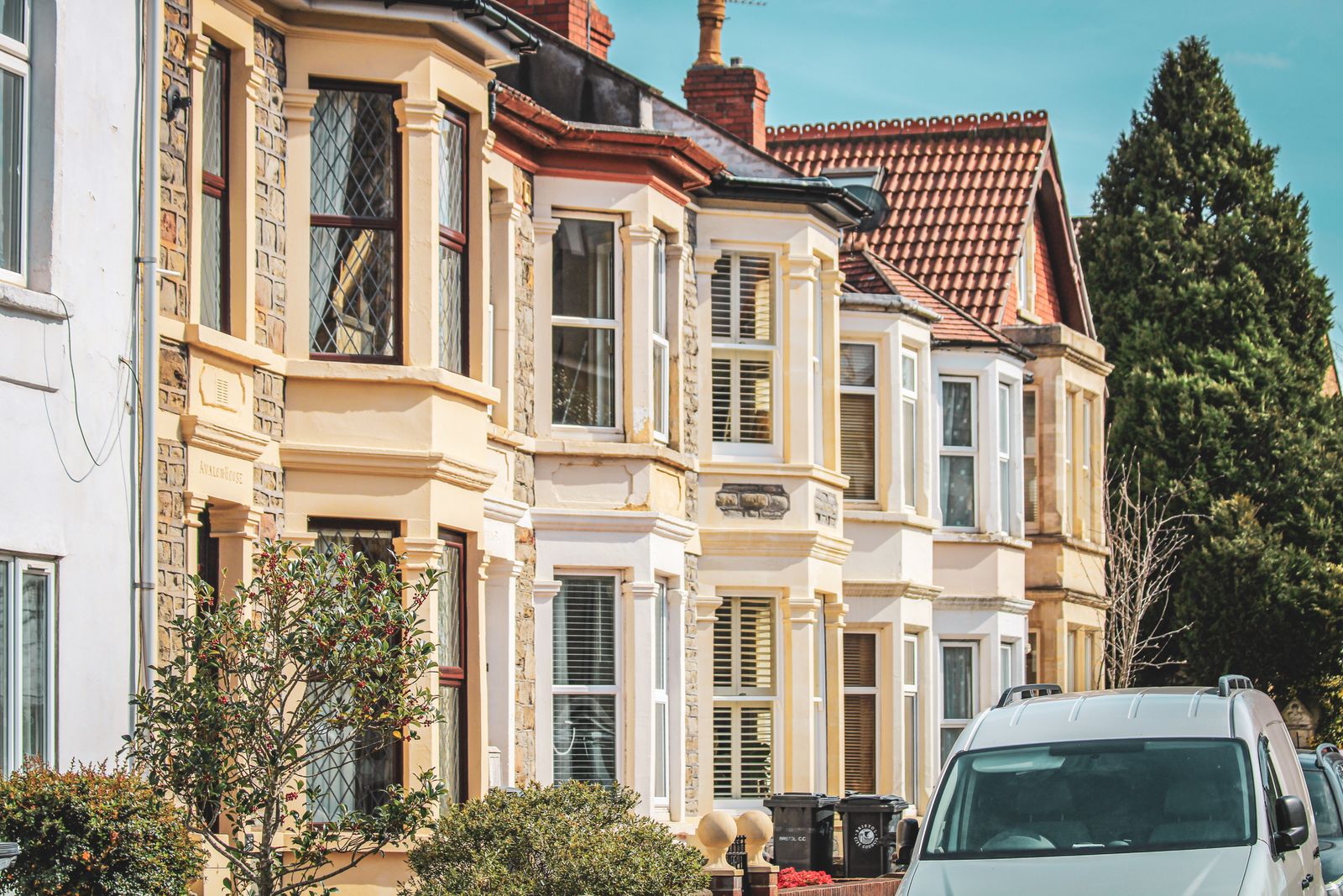 Traditional stone-fronted houses on a UK residential street